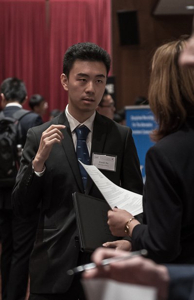 Student in suit at career fair
